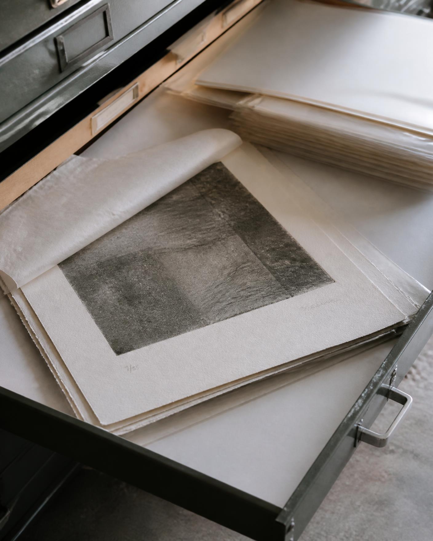 Works on paper stored flat in an archival flat-file drawer